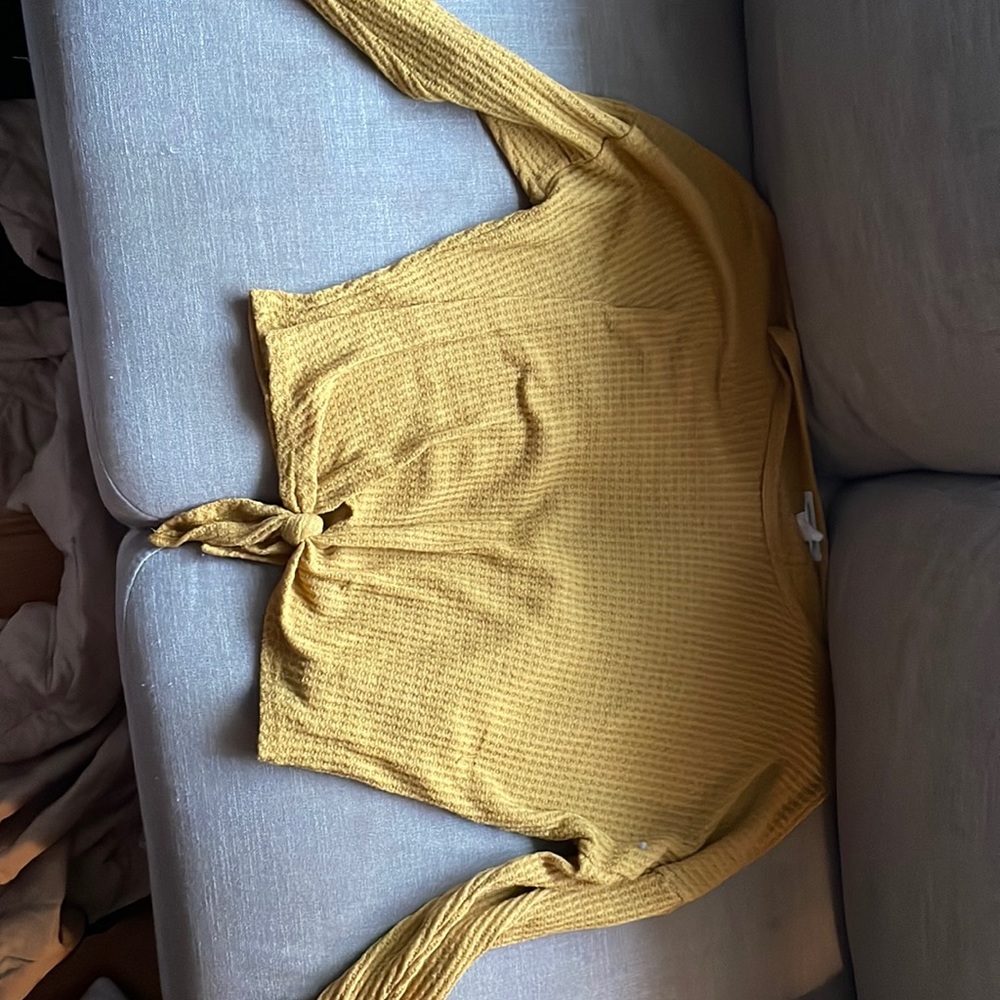 cropped yellow long sleeve shirt with a tie at the bottom